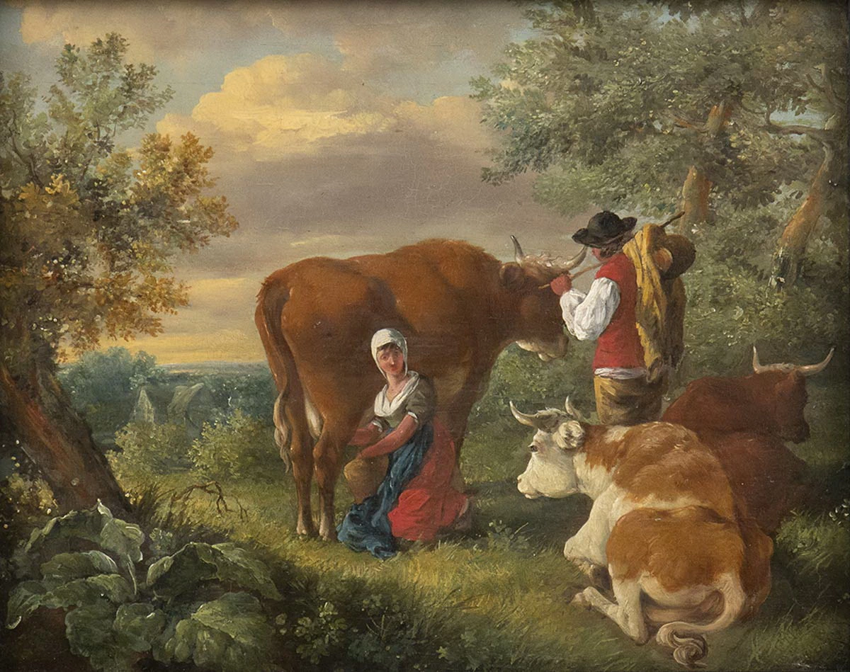 Contadina che munge la mucca